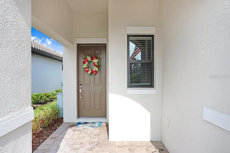 Exterior details and patio area of a home in Esplanade at Artisan Lakes, Palmetto (Image 4).
