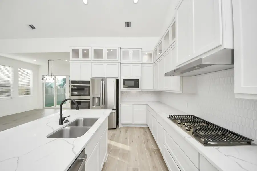 Furnished interior view inside a new home in Meridiana, Manvel (Image 10).