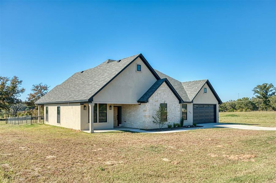 Front exterior of a new home in , Emory, TX, highlighting curb appeal (Image 17).