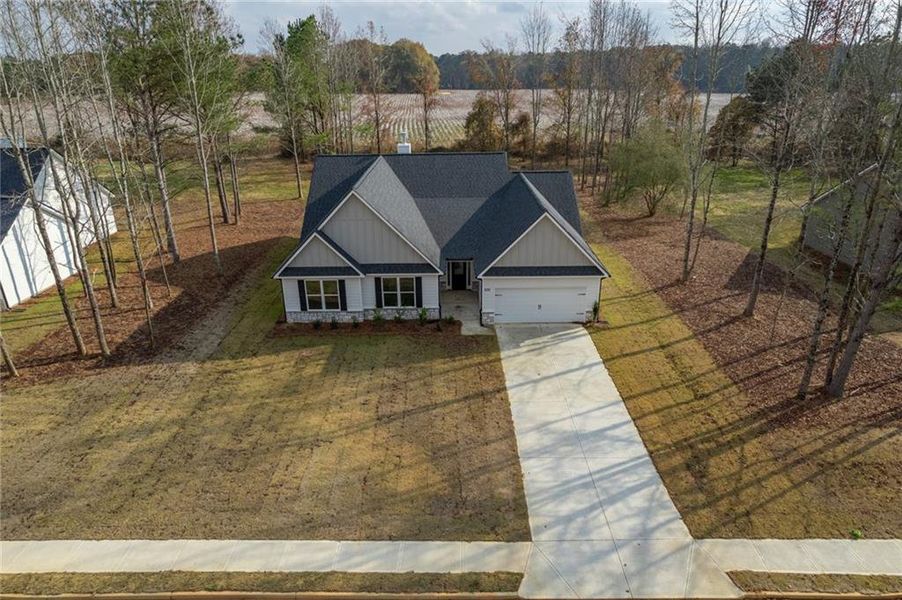Front exterior of a new home in , Good Hope, GA, highlighting curb appeal (Image 24).