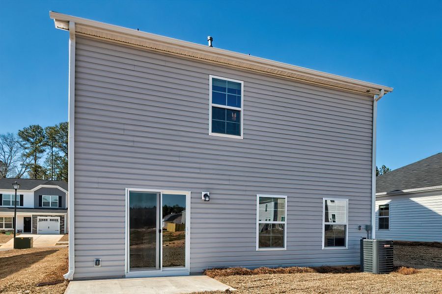 Front exterior of a new home in Harmon Hill Estates, Hopkins, SC, highlighting curb appeal (Image 21).
