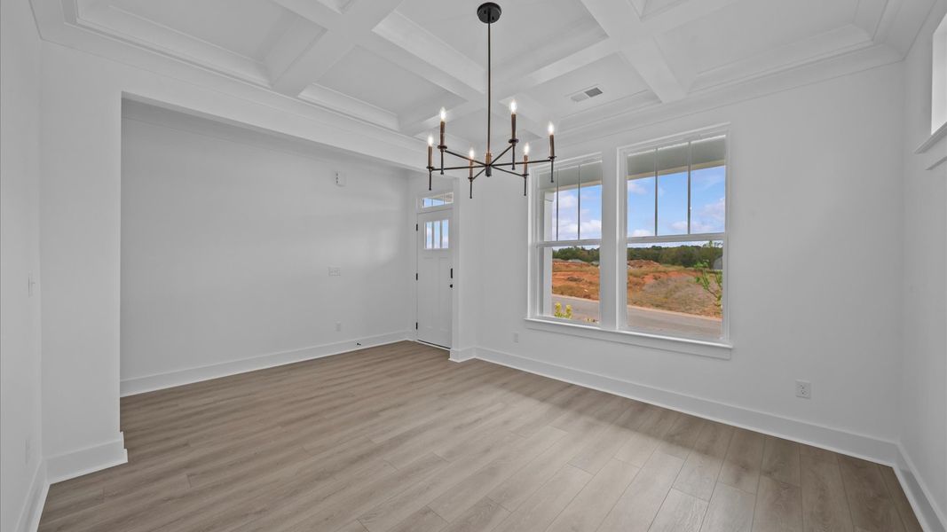 Elegant coffered ceiling sets the tone in this tasteful, entertaining-ready dining room Elegant coffered ceiling sets the tone in this tasteful, entertaining-ready dining room