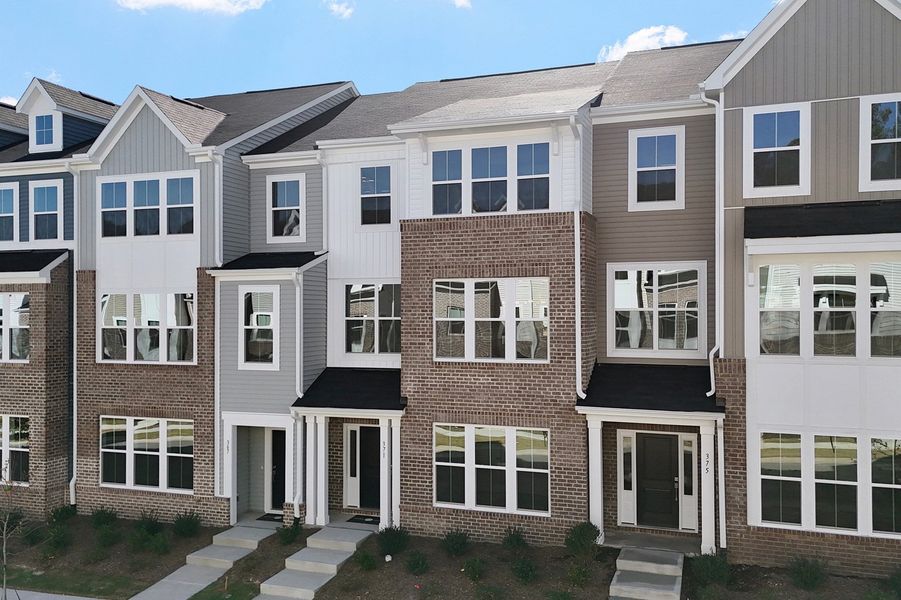 Front exterior of a new home in Renaissance at White Oak, Garner, NC, highlighting curb appeal (Image 21).