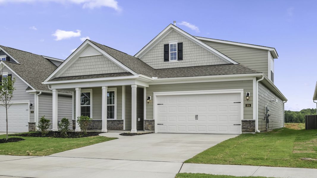 Front exterior of a new home in The Villas at Kinsley, Jamestown, NC, highlighting curb appeal (Image 2). Front exterior of a new home in The Villas at Kinsley, Jamestown, NC, highlighting curb appeal (Image 2).