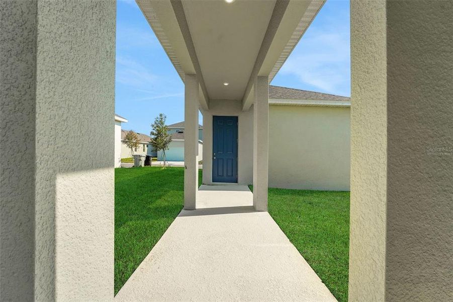 Front exterior of a new home in Crossroads at Kelly Park, Apopka, FL, highlighting curb appeal (Image 17).