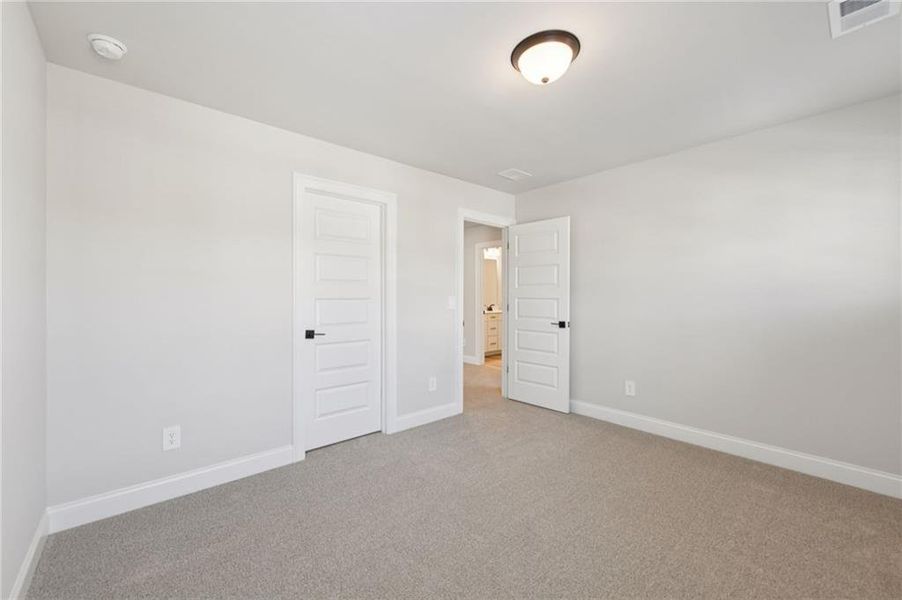Spacious, unfurnished interior of a new home in Vines at Mill Creek - Estate Series, Braselton (Image 44).