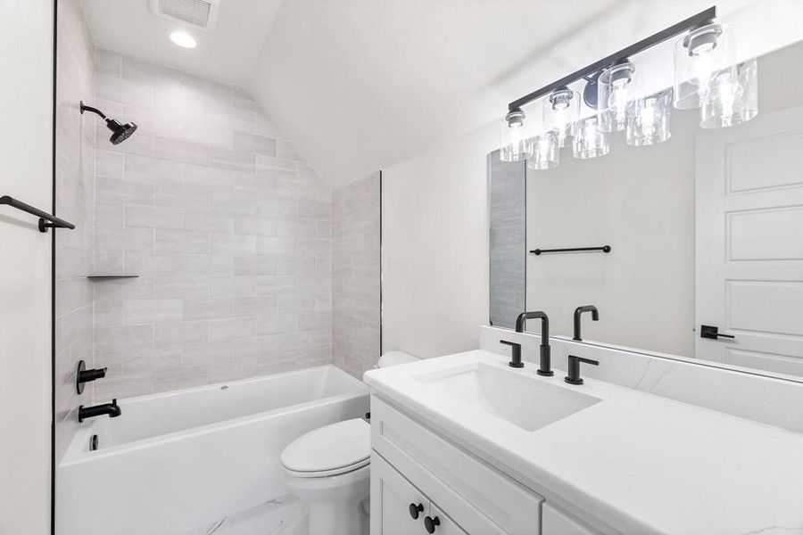 Guest Bathroom featuring shower / bath tub combination Guest Bathroom featuring shower / bath tub combination