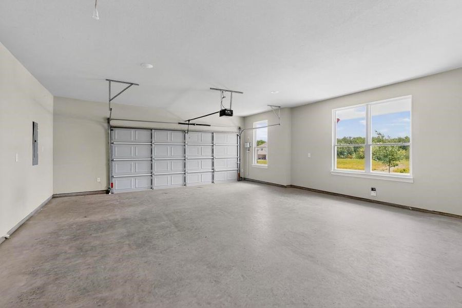 Garage with a garage door opener and electric panel