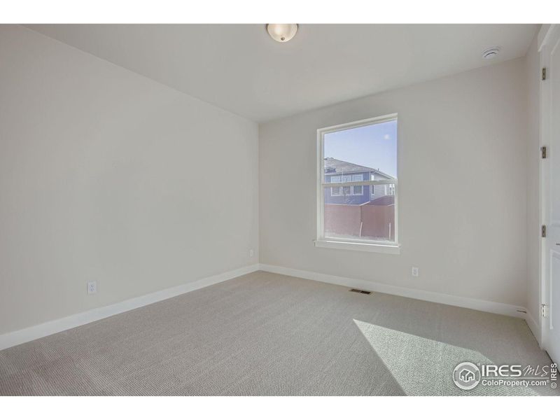 Spacious, unfurnished interior of a new home in RainDance National 60/70, Windsor (Image 16).