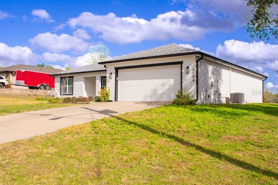 Front exterior of a new home in , Spring Hill, FL, highlighting curb appeal (Image 2). Front exterior of a new home in , Spring Hill, FL, highlighting curb appeal (Image 2).