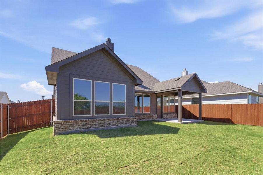 Exterior details and patio area of a home in Covenant Park, Springtown (Image 25).