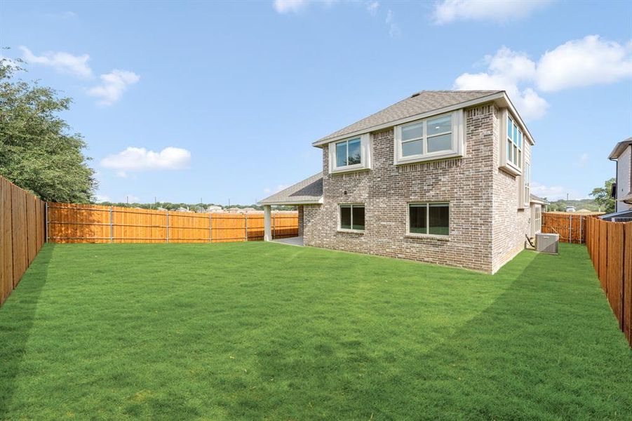 Front exterior of a new home in Glenwood Meadows, Denton, TX, highlighting curb appeal (Image 24). Front exterior of a new home in Glenwood Meadows, Denton, TX, highlighting curb appeal (Image 24).