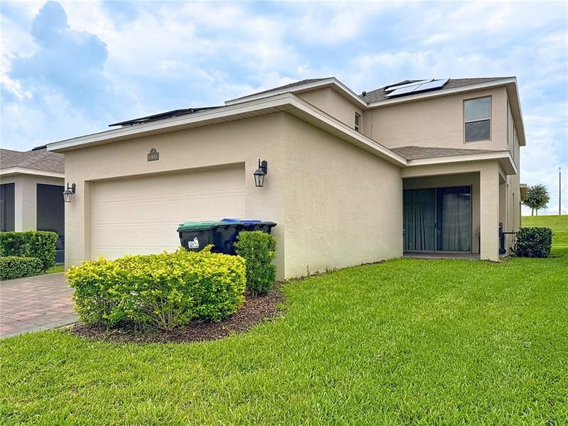 Front exterior of a new home in , Winter Garden, FL, highlighting curb appeal (Image 32).