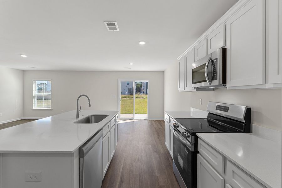 Representative furnished interior of a home built from the Larch Duplex by McGuinn Homes in South Lake Commons, Lexington (Image 6).