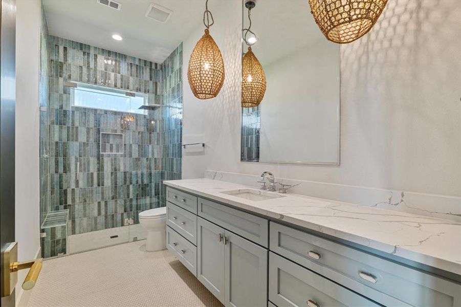 Full bath featuring vanity, walk in shower, a chandelier, and recessed lighting