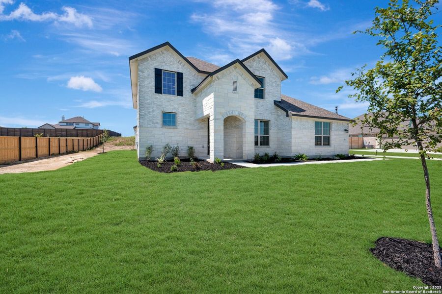 Front exterior of a new home in Everly Estates, San Antonio, TX, highlighting curb appeal (Image 16). Front exterior of a new home in Everly Estates, San Antonio, TX, highlighting curb appeal (Image 16).