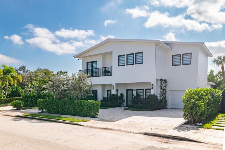 Front exterior of a new home in , West Palm Beach, FL, highlighting curb appeal (Image 22). Front exterior of a new home in , West Palm Beach, FL, highlighting curb appeal (Image 22).