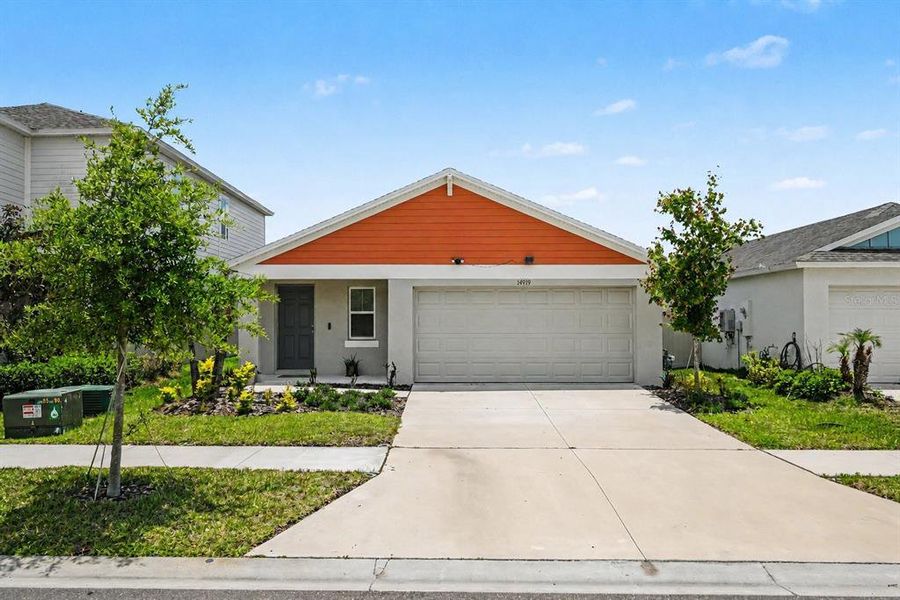 Front exterior of a new home in New Home Communities Near Tampa, Ocala, and Orlando, Florida, Lithia, FL, highlighting curb appeal (Image 2). Front exterior of a new home in New Home Communities Near Tampa, Ocala, and Orlando, Florida, Lithia, FL, highlighting curb appeal (Image 2).