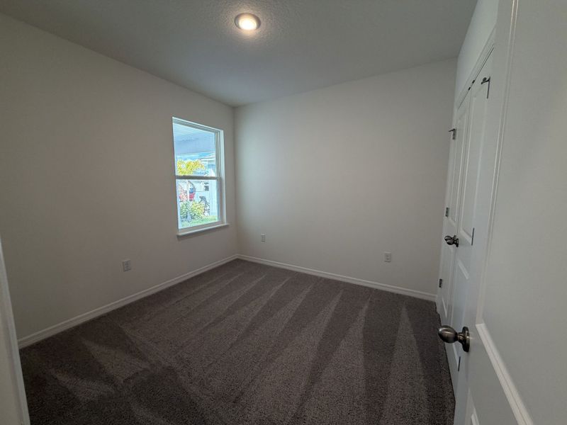 Spacious, unfurnished interior of a new home in Hammock Reserve, Haines City (Image 9).