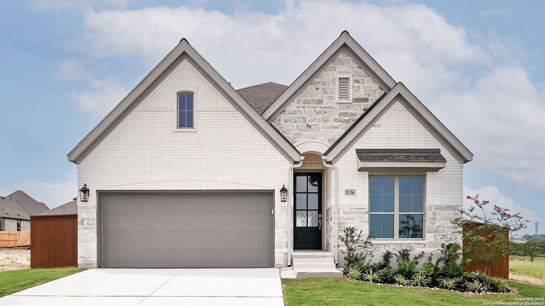Front exterior of a new home in Homestead 55', Cibolo, TX, highlighting curb appeal (Image 26). Front exterior of a new home in Homestead 55', Cibolo, TX, highlighting curb appeal (Image 26).