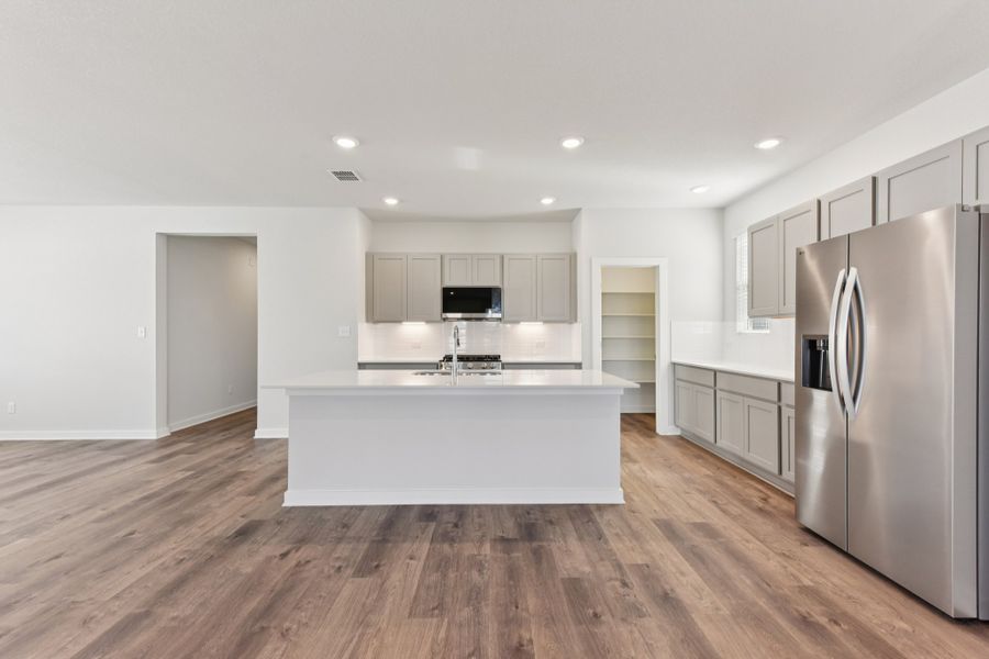 A kitchen with white cabinets. A kitchen with white cabinets.