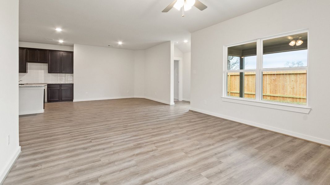 Representative furnished interior of a home built from the Driskill by Brightland Homes in Sunterra, Katy (Image 8).