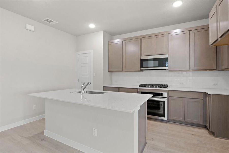 Kitchen in the Willow home plan by Trophy Signature Homes – REPRESENTATIVE PHOTO Kitchen in the Willow home plan by Trophy Signature Homes – REPRESENTATIVE PHOTO