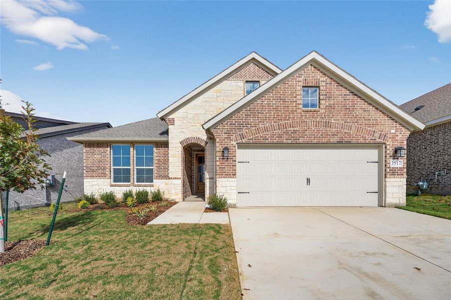 Front exterior of a new home in Liberty Pointe, Gainesville, TX, highlighting curb appeal (Image 21).