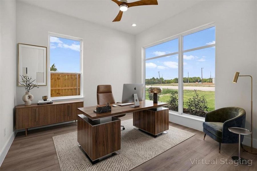 The room features light-colored walls, recessed lighting, and a ceiling fan The room features light-colored walls, recessed lighting, and a ceiling fan