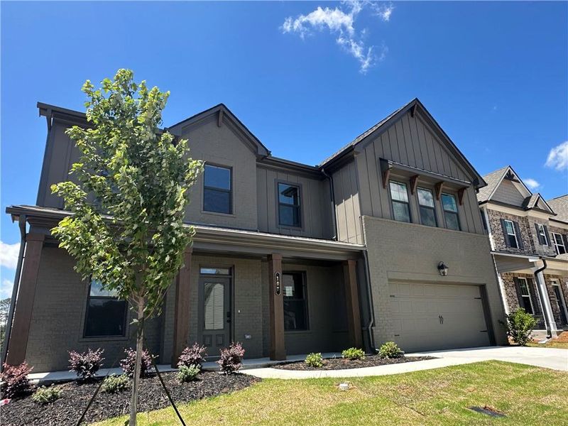 Front exterior of a new home in Summerlin, Winder, GA, highlighting curb appeal (Image 39). Front exterior of a new home in Summerlin, Winder, GA, highlighting curb appeal (Image 39).