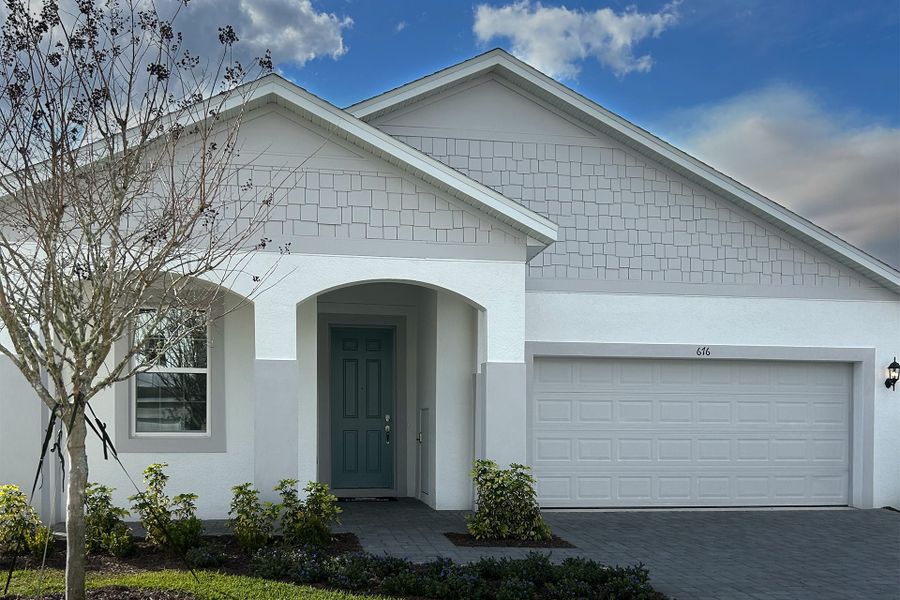 Front exterior of a new home in Trinity Gardens, Deland, FL, highlighting curb appeal (Image 14).
