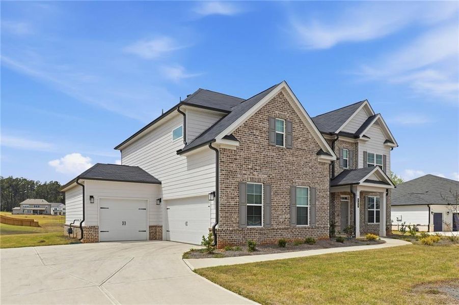 Front exterior of a new home in , McDonough, GA, highlighting curb appeal (Image 22).