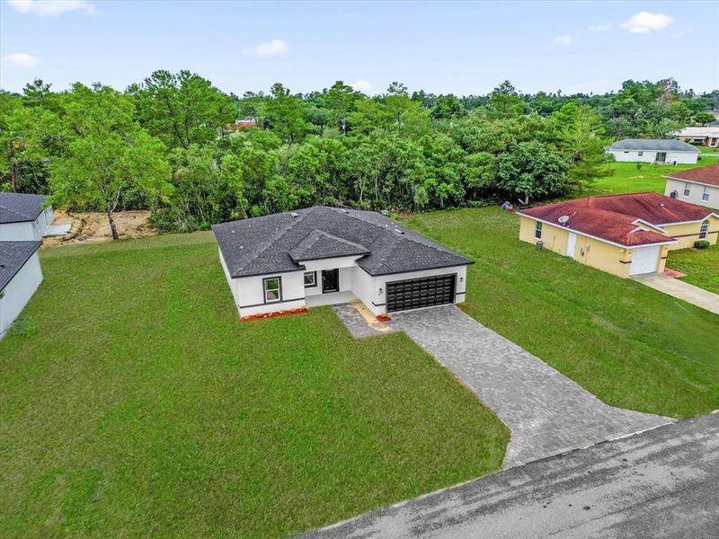 Front exterior of a new home in , Ocala, FL, highlighting curb appeal (Image 22).