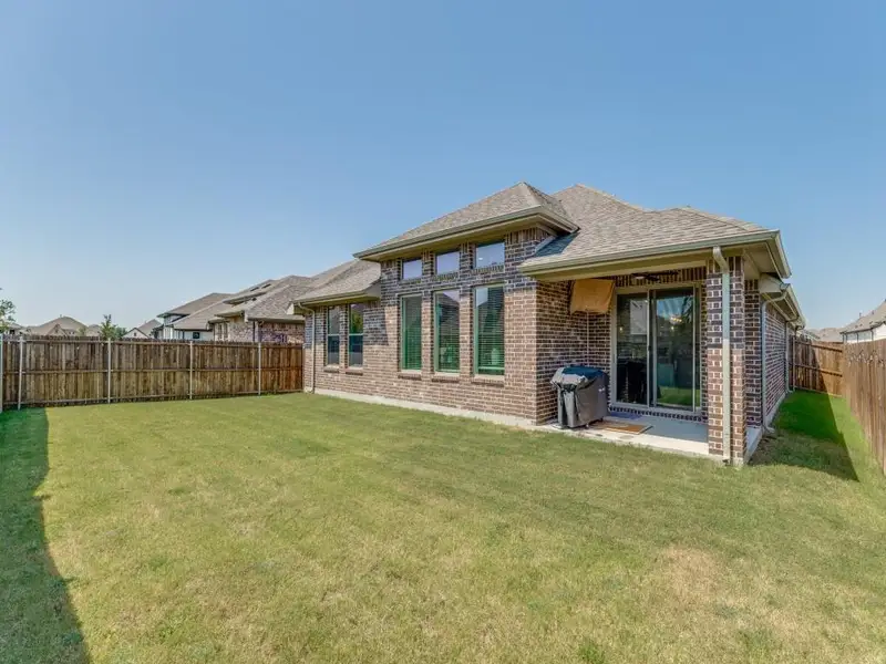 Exterior details and patio area of a home in , Anna (Image 2). Exterior details and patio area of a home in , Anna (Image 2).
