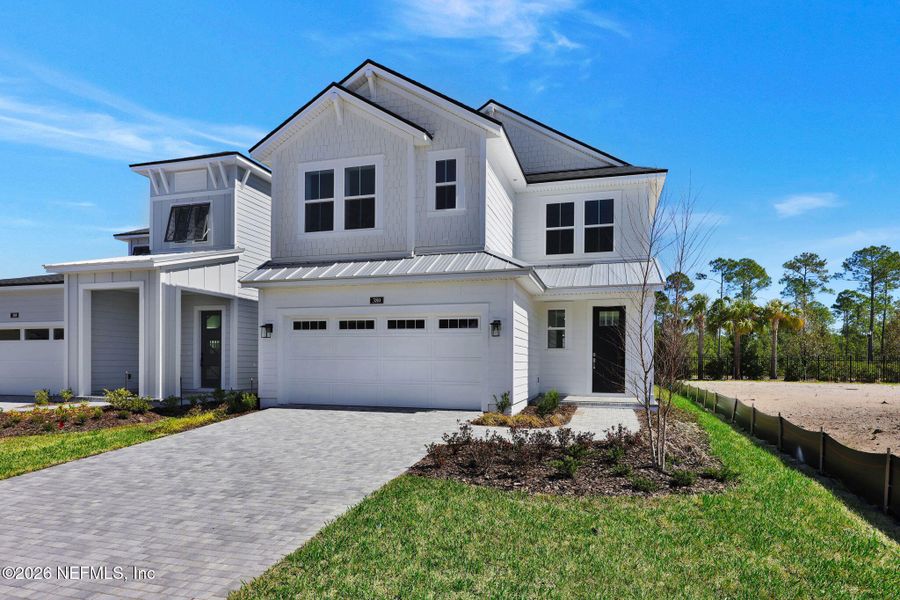 Front exterior of a new home in Seabrook Village at Seabrook, Ponte Vedra, FL, highlighting curb appeal (Image 22).
