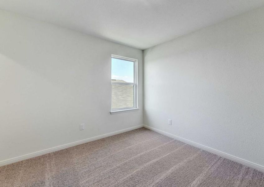 Rio bedroom with side window, white on gray walls, and brown carpets