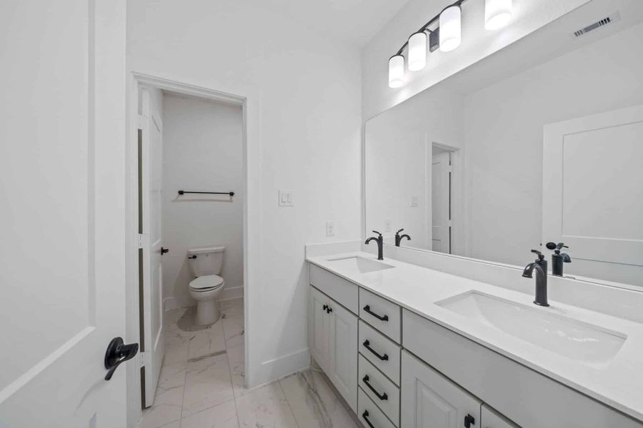 Representative furnished interior of a home built from the Waterloo – 60′ Lot by Chesmar Homes in Lakes of Cane Island, Katy (Image 8).