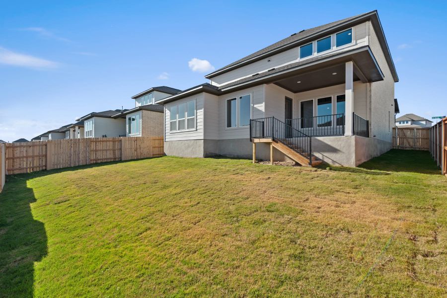 Exterior details and patio area of a home in Lariat, Liberty Hill (Image 23).