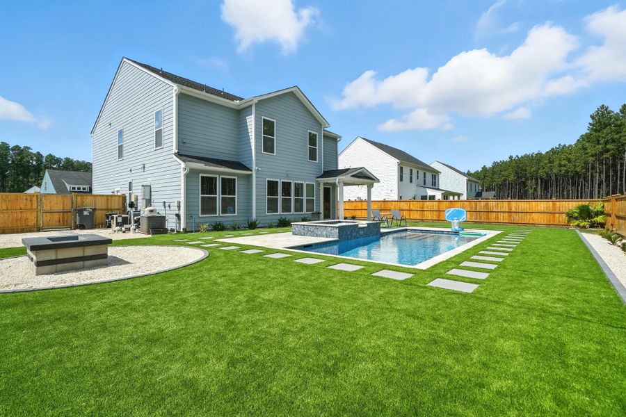 Front exterior of a new home in , Ravenel, SC, highlighting curb appeal (Image 24).