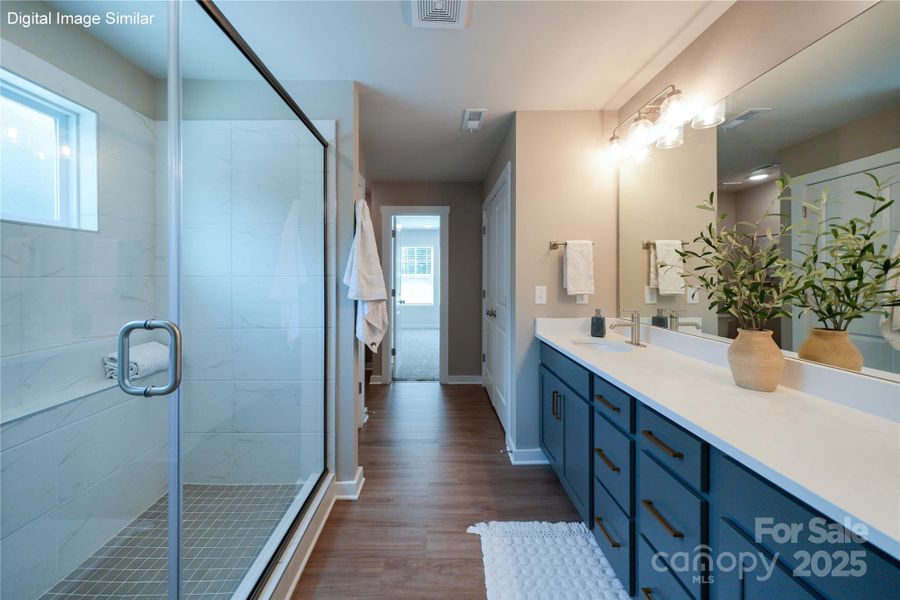 Digital Image Similar - Primary Bathroom has a large shower and linen closet for storage.