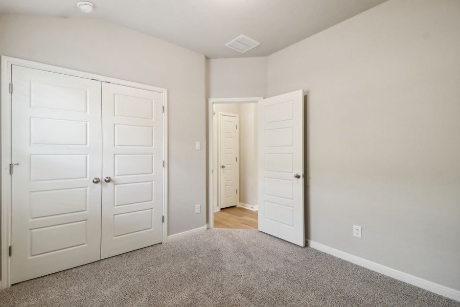 Guest bedroom in the Cascade floorplan at a Meritage Homes community.