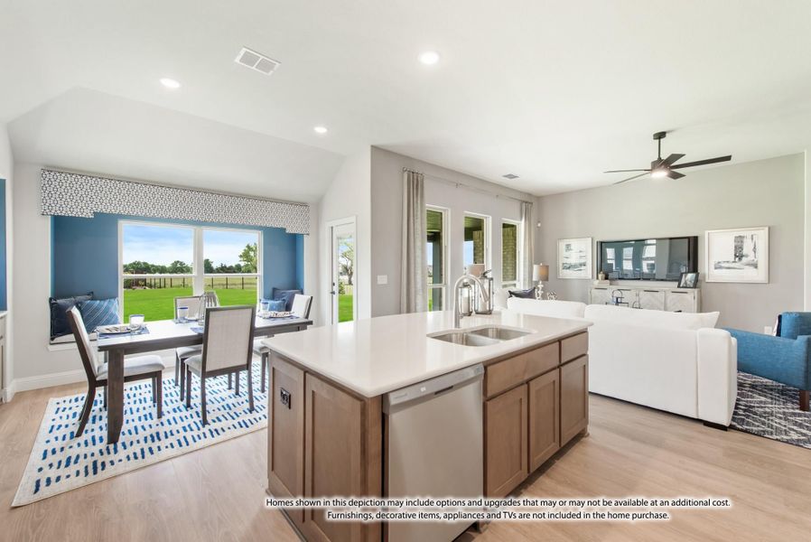 Open-concept kitchen with center island, flowing into dining area and living room with hardwood floors and large windows. Open-concept kitchen with center island, flowing into dining area and living room with hardwood floors and large windows.