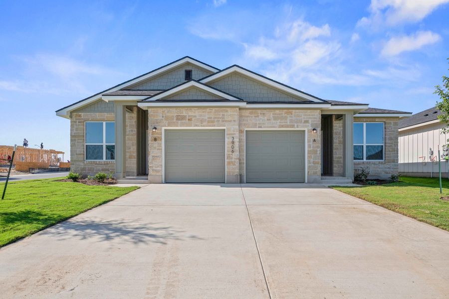 Front exterior of a new home in The Preserve at Thousand Oaks Duplexes, Killeen, TX, highlighting curb appeal (Image 1). Front exterior of a new home in The Preserve at Thousand Oaks Duplexes, Killeen, TX, highlighting curb appeal (Image 1).