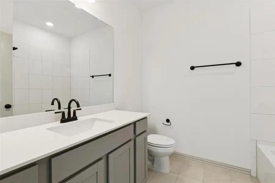 Guests will feel right at home in this beautifully finished guest bath.