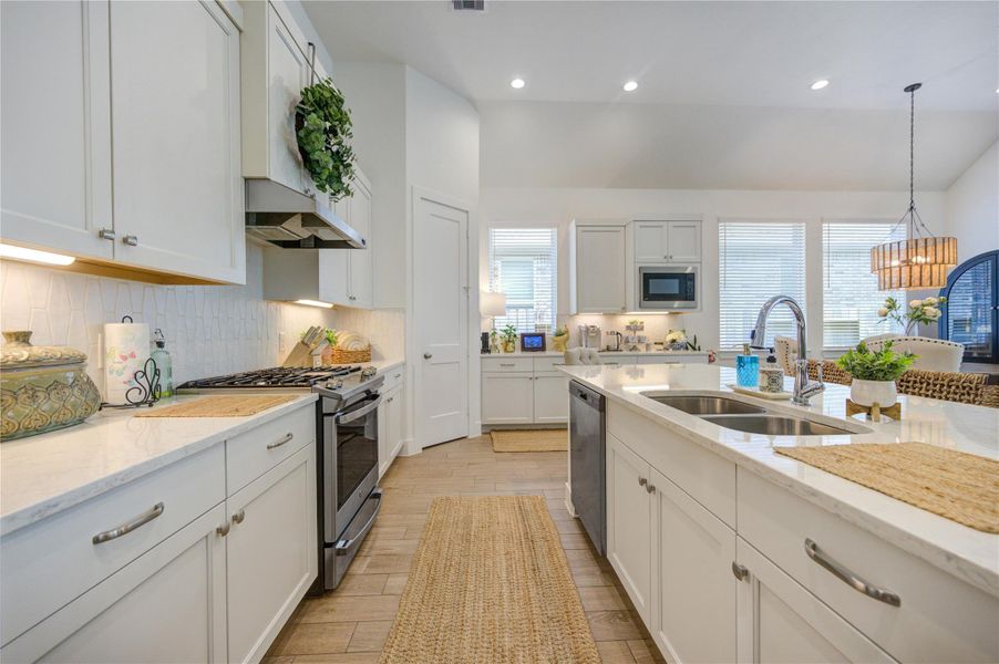 This kitchen offers plenty of room for meal preparation. This kitchen offers plenty of room for meal preparation.