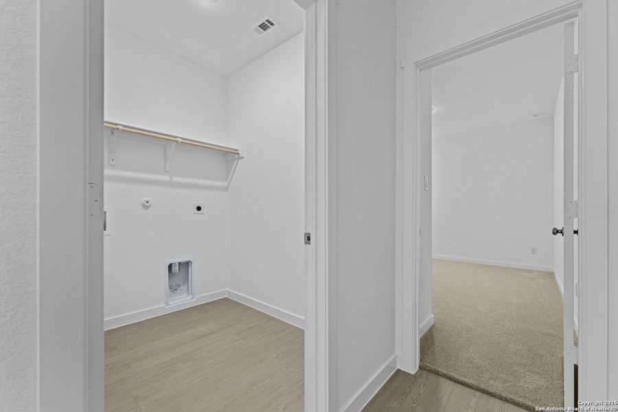 Spacious, unfurnished interior of a new home in Waterwheel: Coastline Collection, San Antonio (Image 15).