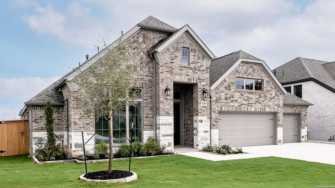 Front exterior of a new home in Johnson Ranch, Bulverde, TX, highlighting curb appeal (Image 2). Front exterior of a new home in Johnson Ranch, Bulverde, TX, highlighting curb appeal (Image 2).