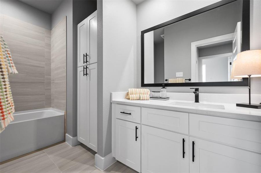 Secondary bathroom with builtin cabinets