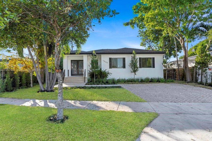 Front exterior of a new home in , Miami, FL, highlighting curb appeal (Image 1). Front exterior of a new home in , Miami, FL, highlighting curb appeal (Image 1).