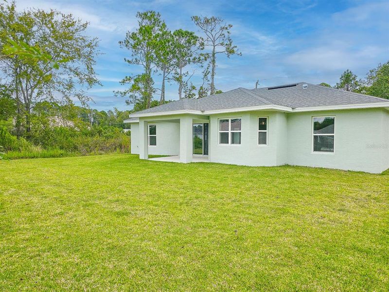 Front exterior of a new home in , Palm Coast, FL, highlighting curb appeal (Image 24).
